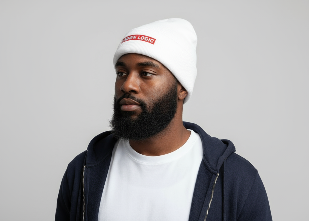 Man wearing a white beanie with 'Crown Loco' logo on a gray background